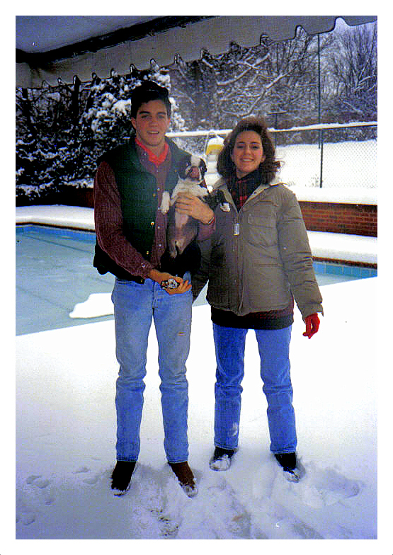 pic of Jerri Lynn and John D. with Hank in the snow. framead in white jpg